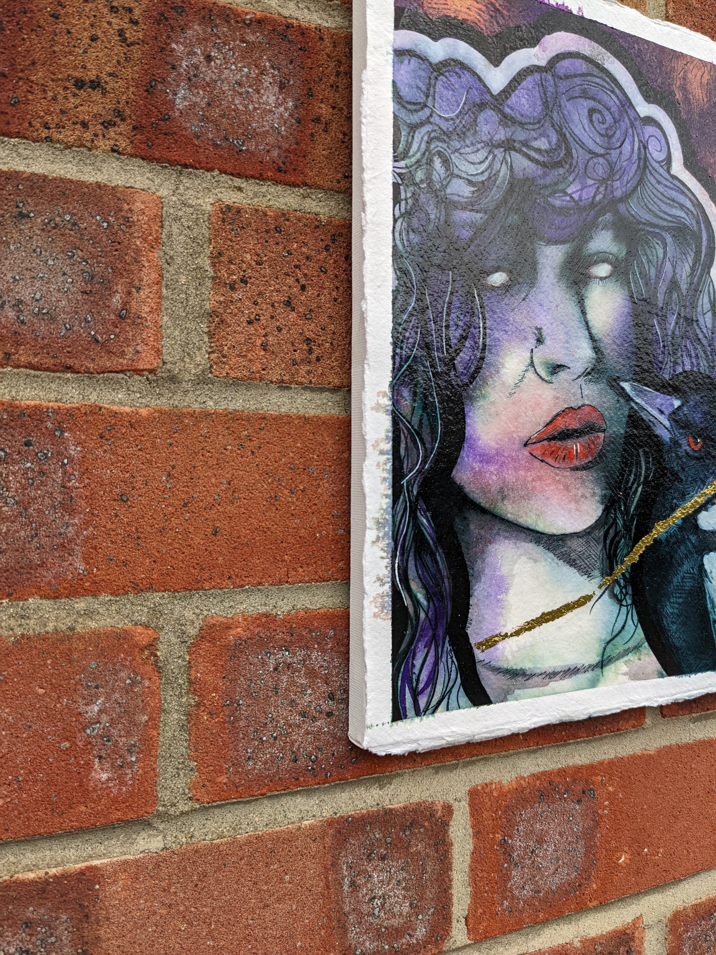 a side view of this original painting on the morrigan with white eyes, wrapped in a gold chain with a magpie, a symbol of witchcraft, celtic goddess