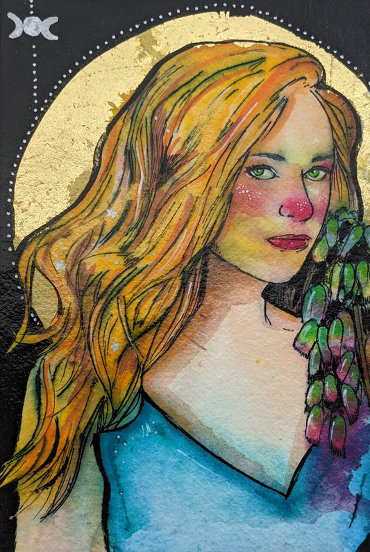 full frontal image of the witch character freya, with gold leaf and fly agaric detail, with her Freya, inks and watercolour painting by Dianne Bowell, an original painting from the Middlesbrough studio of British female artist Dianne Bowell. 